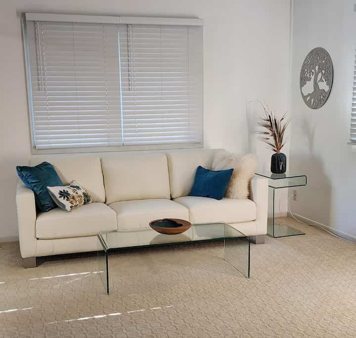 Keeping it clean and serene in my all-white living room! 🤍✨ A perfect canvas for cozy vibes and chic decor. Who else loves the freshness of a white interior? 🛋️🌿 #WhiteLivingRoom #HomeDecor #SereneSpaces #GlassTable #WhiteSofa #ModernDecor