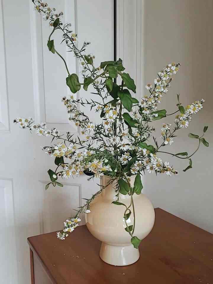 Keeping it classic and fresh with these beautiful white flowers in a chic white vase! 🤍🌼 The perfect touch of elegance for any space. Simple, serene, and oh-so-stylish! 🌿✨ #FloralDecor #WhiteAesthetic #HomeInspo #VaseDecor #WoodFurniture #MinimalistDesign