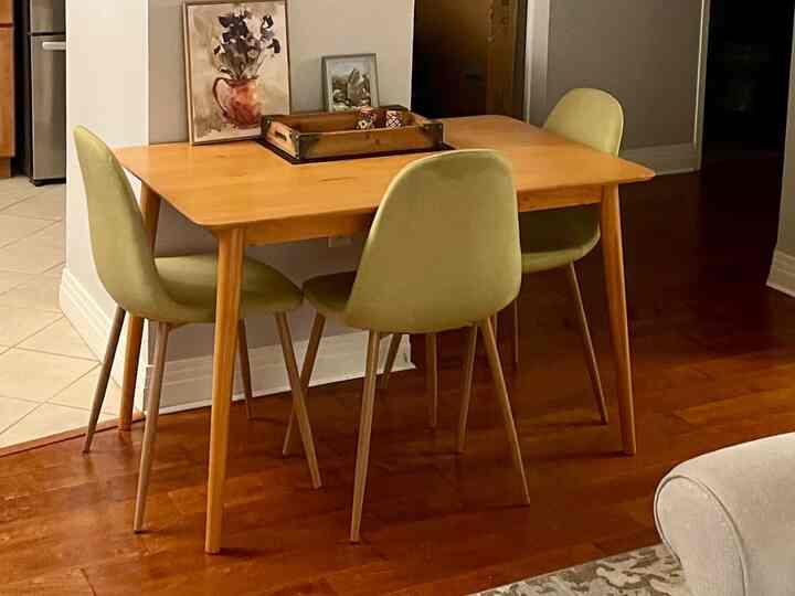 Dining in style with my gorgeous wooden table paired with vibrant green chairs! 🌿✨ The pop of color adds freshness and fun to every meal. Loving this cozy vibe! 🍽️💚 #DiningRoomInspo #ColorfulInteriors #HomeSweetHome #DiningTable #MidCenturyModern #MinimalistDecor
