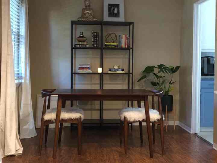 Cozy vibes in the dining area! 🍽️📚 Loving this wooden dining table set paired with a stylish bookshelf. Perfect for enjoying meals and diving into a good book. #HomeStyle #DiningRoomGoals #WoodenElegance 
