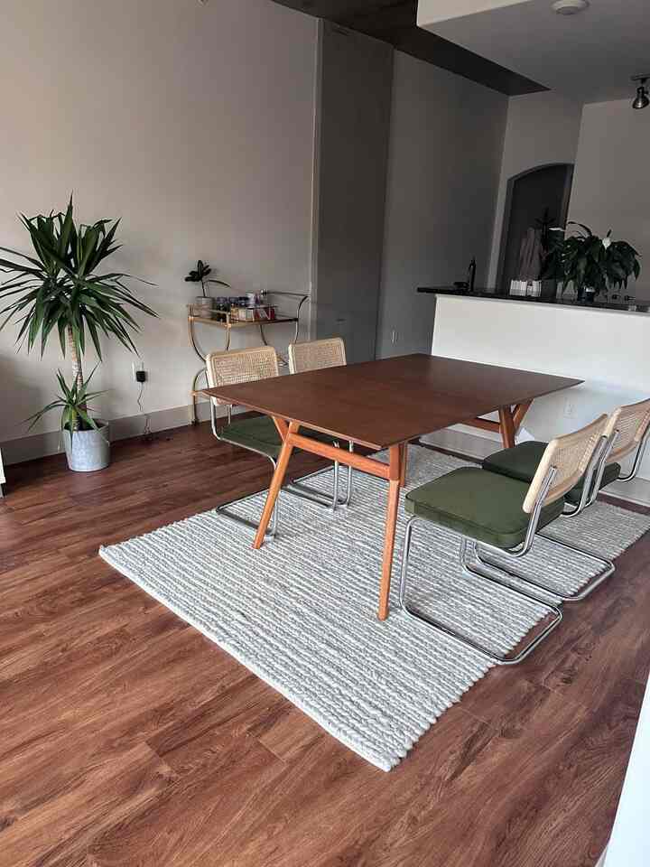 Warmth and style collide with this walnut dining table set, beautifully complemented by a cozy fabric rug! 🍂✨ Perfect for family dinners and inviting gatherings. #DiningRoomGoals #WalnutWood #CozyHome