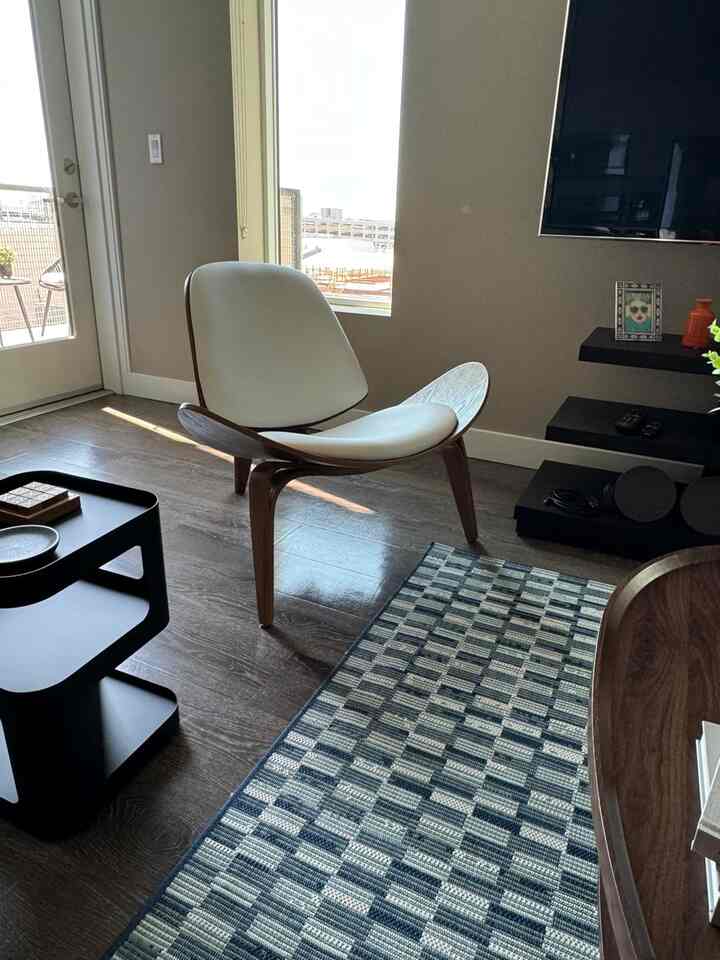 Love how this white wooden lounge chair complements my modern interior! 🤍✨ A perfect blend of style and comfort. #ModernLiving #HomeInspo #ShellChair #MidCenturyModern #ScandinavianDesign