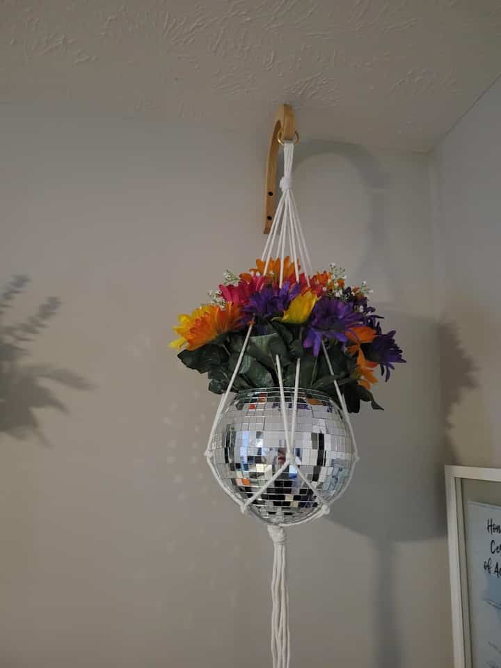 Bringing all the vibes with these colorful disco ball hanging plants! 🌈✨ A fun twist to my space that reflects my playful spirit! 
#DiscoVibes #PlantDecor #Macrame #DiscoBall #BohoDecor