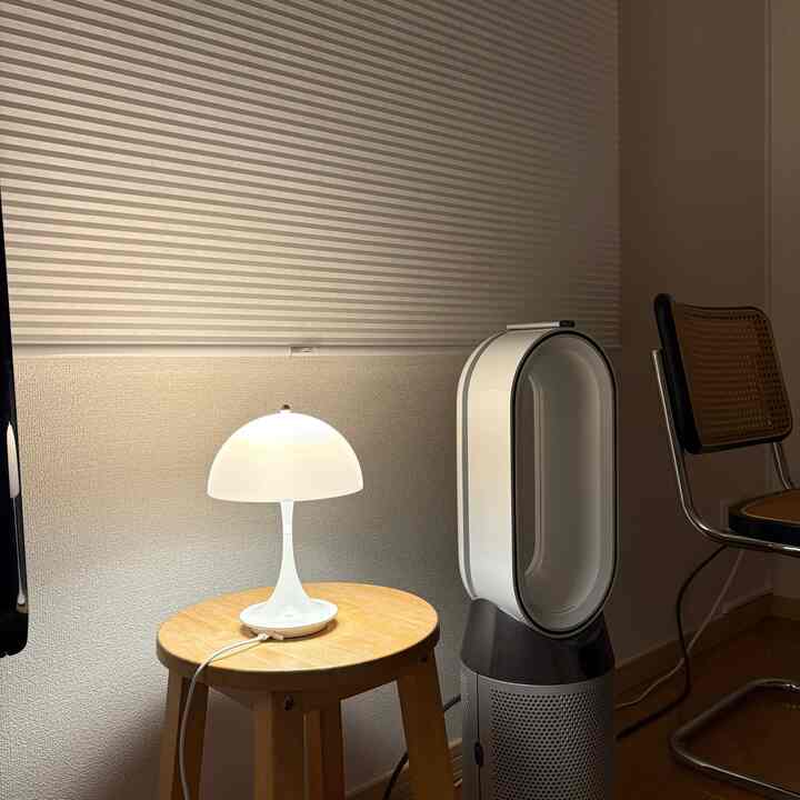 A compact space for a single household featuring Mid-Century Modern style with white tones and wood accents