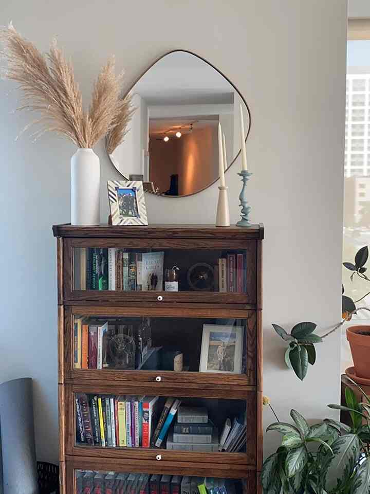 Styled with love and a touch of vintage charm! ❤️📚 This walnut bookshelf holds not just books, but memories. #BookshelfStyling #Bookshelf #MidCenturyModern #HomeDecor