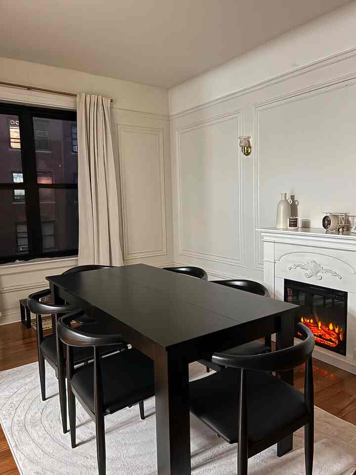 Chic and cozy! This black dining set complements the warmth of my fireplace beautifully. 🔥🖤 #DiningRoomGoals #HomeStyle