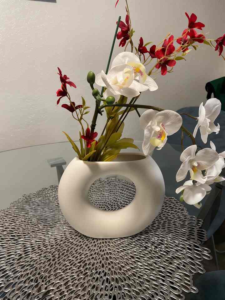 Brightening up my space with a white vase full of colorful flowers! A little touch of nature and joy. 🌸✨ #HomeDecor #FlowerPower