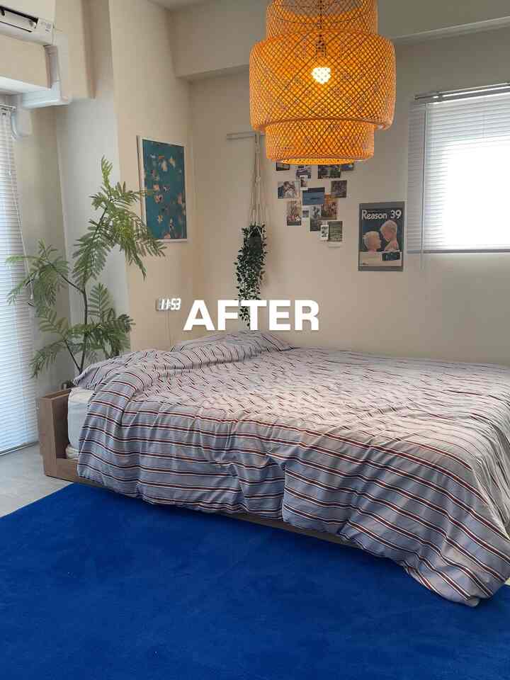 Natural-toned bedroom featuring a large bed and blue rug creating a cozy atmosphere