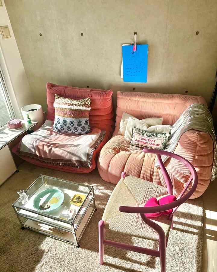 Pink-toned sofas and coffee table in a cozy living room space