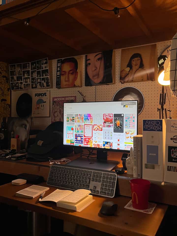 Warm brown wood tone home office space featuring Dell monitor and LED lighting, creating a cozy workspace