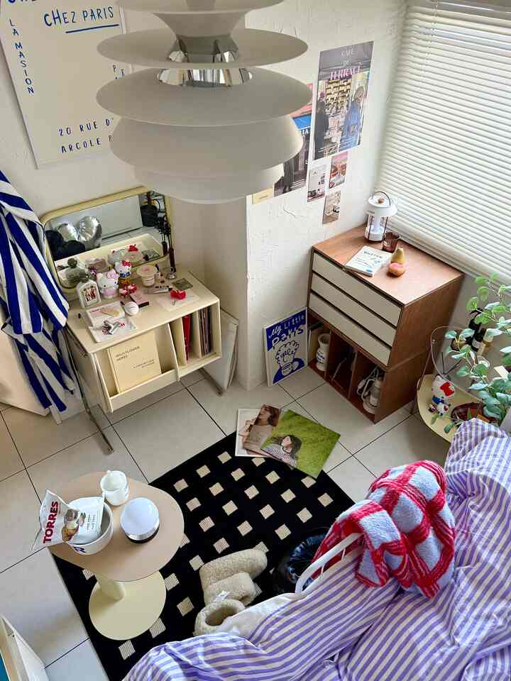 White and black toned bedroom featuring bed, dresser, and rug in cozy personal space
