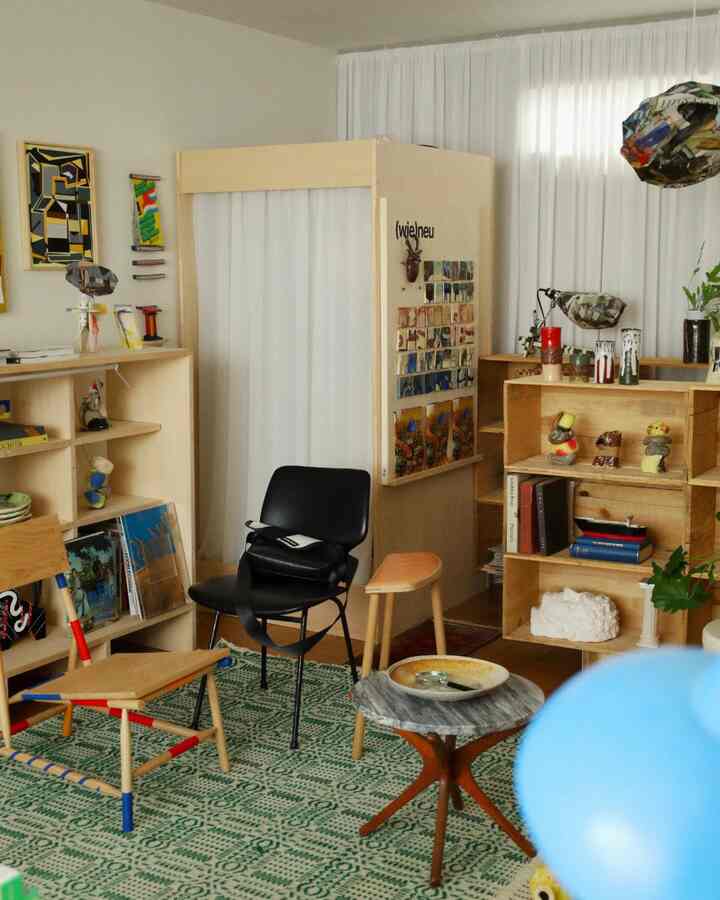 Beige and wood-tone natural living room for single household featuring DIY vintage furniture and patterned rug in cozy atmosphere