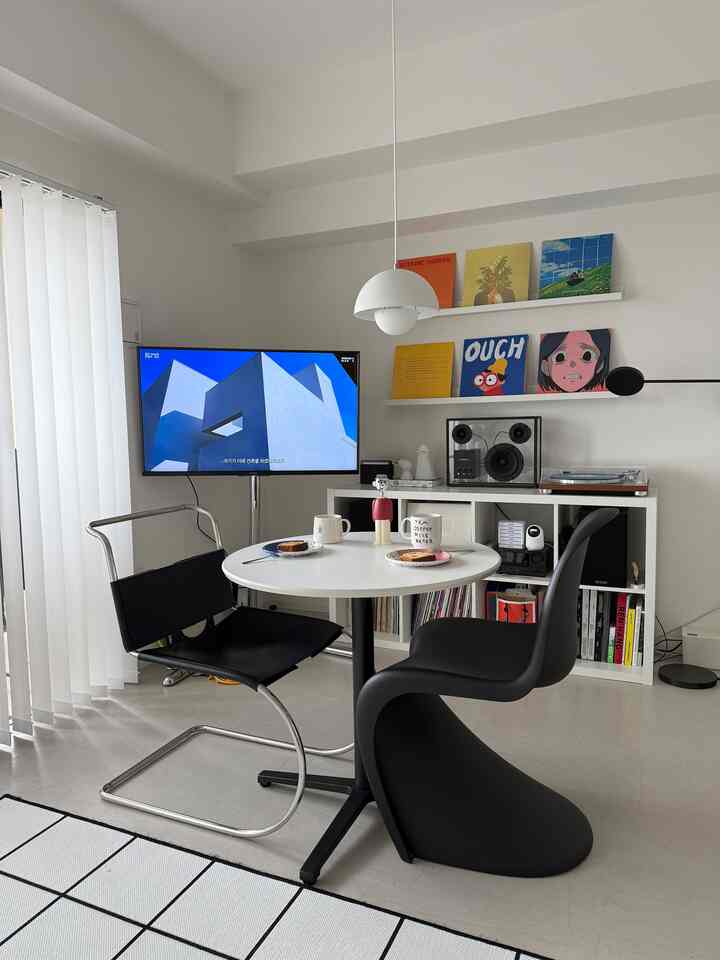 White and black toned two-person home cafe space featuring modern Korean interior style with clean and minimalist design