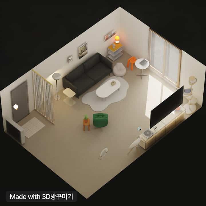 ベージュの床と壁にダークグレーのソファが配置されたリビング、白いコーヒーテーブルとカーテンが調和したナチュラルモダンな雰囲気のインテリア