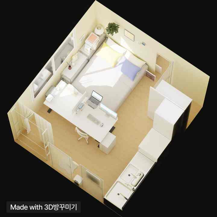 White and natural color toned studio apartment featuring bedroom, kitchen, and a desk with computers in a compact layout