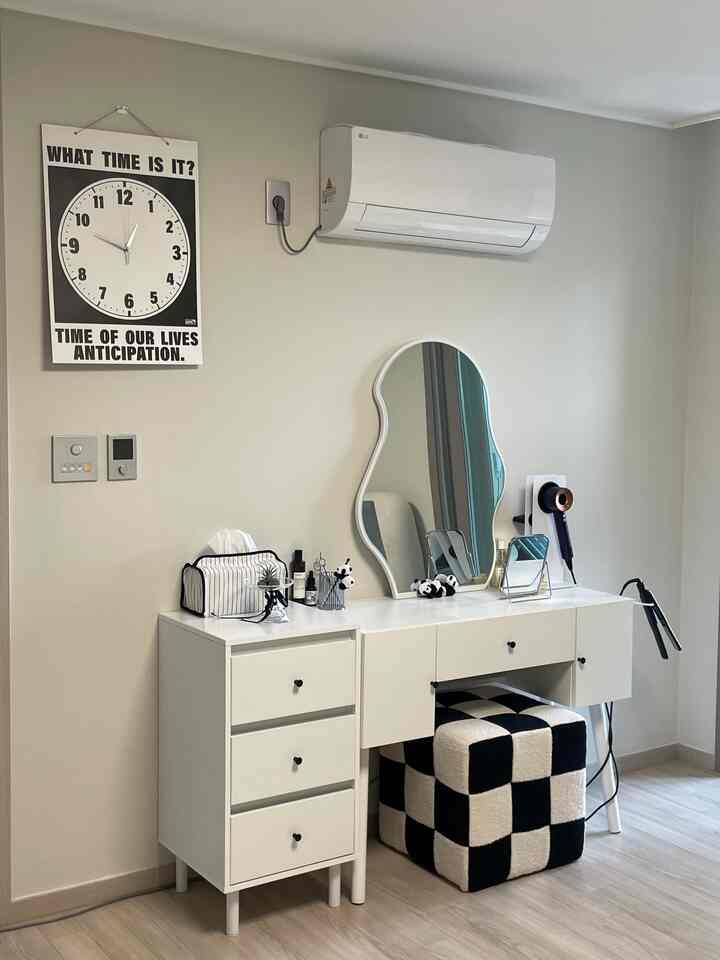 Modern and clean white-toned vanity and dresser setup in a practical and minimal room