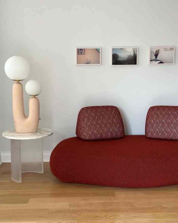 A pop of red in a modern mood ❤️ This fabric sofa is the cozy statement my space needed. #ModernLiving #RedSofaVibes #HomeStyle
credit: @enyleeparker