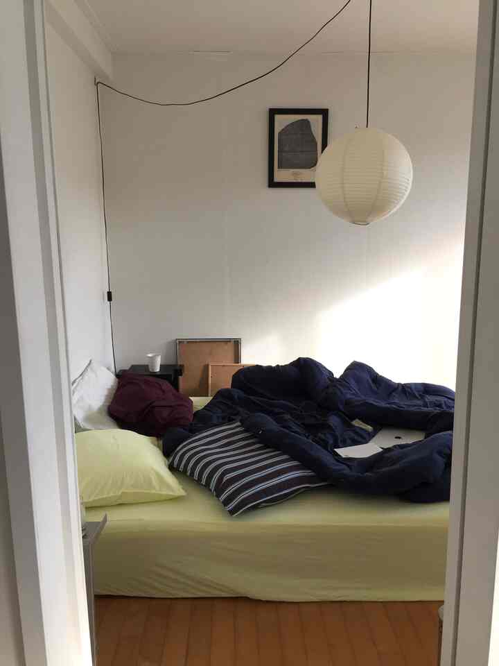 Yellow and navy toned bedroom featuring thick bedding and pillows creating a cozy autumn atmosphere