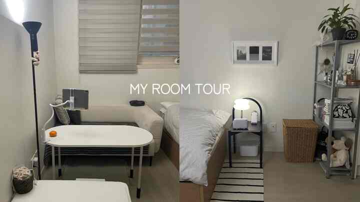 白と黒を基調としたワンルームの寝室空間で、ソファ、ベッド、棚、シンプルモダンなインテリアが特徴的です。