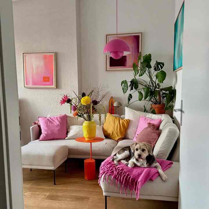A cozy corner where soft neutrals meet playful pops of color.
Warm light, fresh flowers, and a little joy curled up on the sofa. 💗🐶

Credit: @ronjachlebowski

#CozyInterior #ColorfulHome #ModernLiving #InteriorInspo #HomeVibes
#AccentColors #PinkDecor #HappyHome #SmallSpaceLiving #DesignDetails