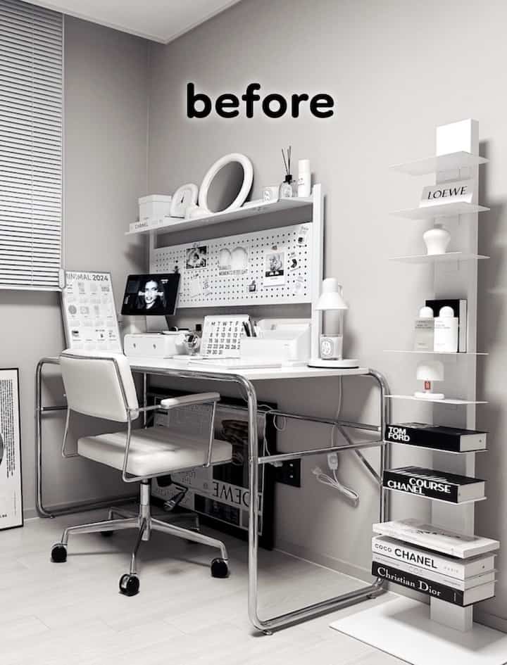 Minimal white and gray home office featuring a tidy desk and bookshelf with organized decor