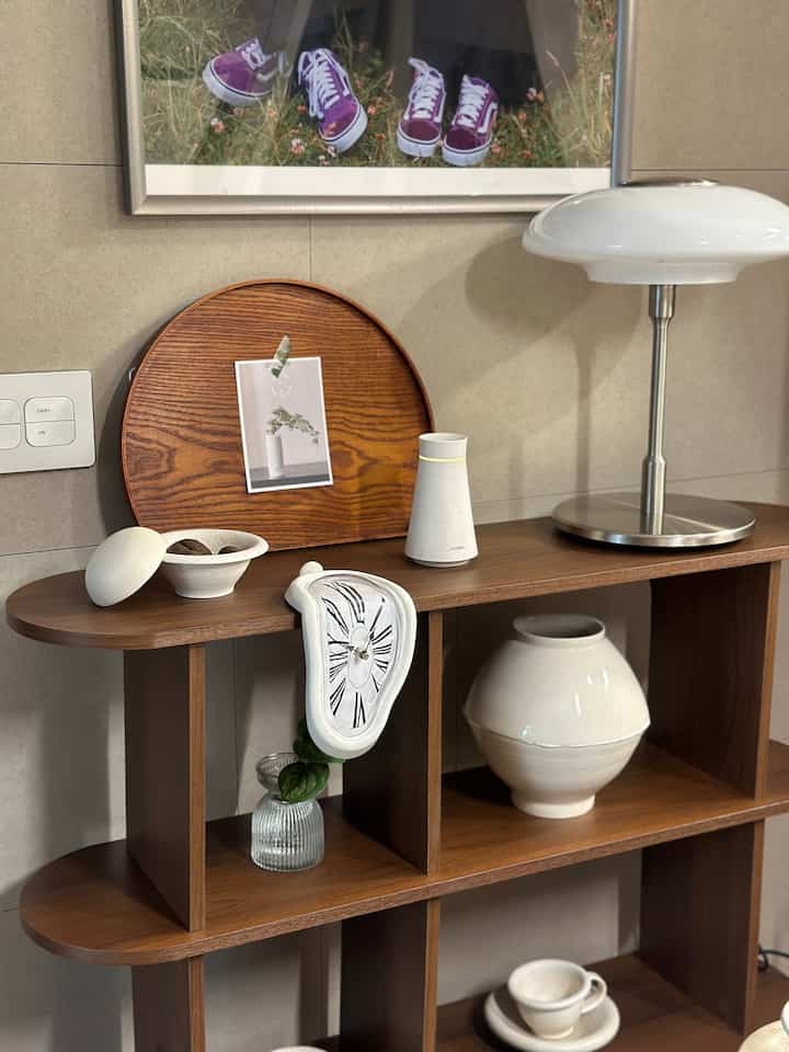 Natural-toned kitchen decorative shelving featuring wood tones and simple elegant decor items