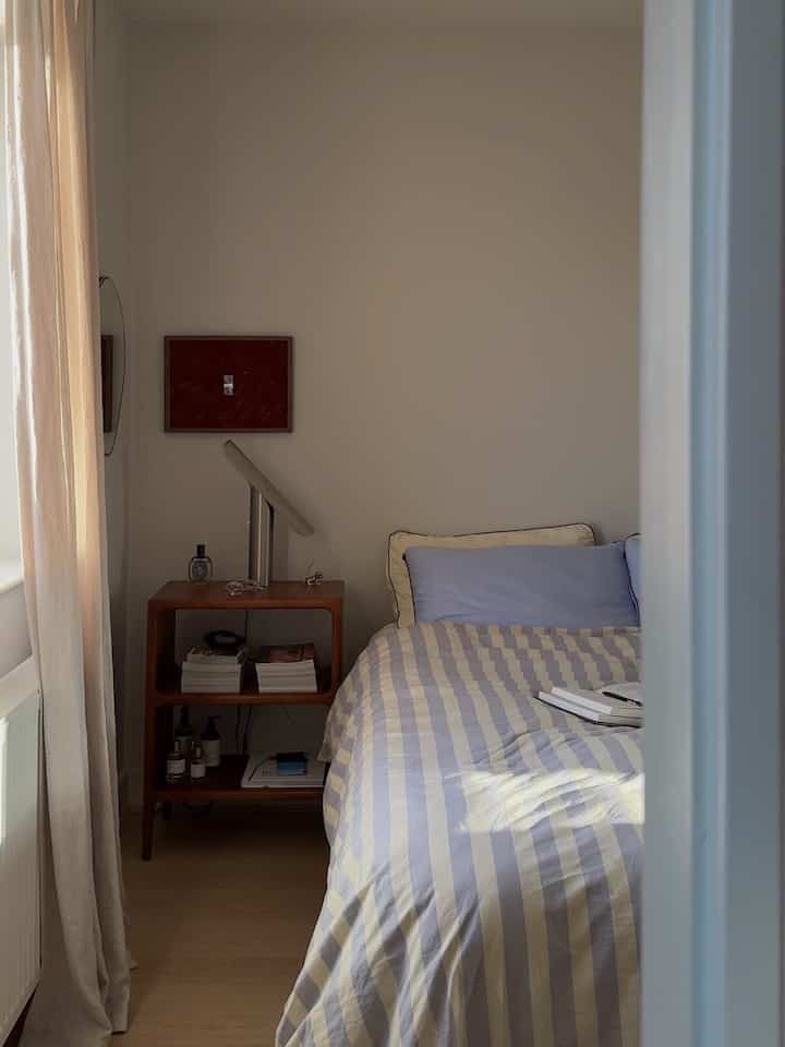 Soft stripes, warm wood, and a quiet wash of morning light create a bedroom that feels instantly restful. Simple styling and a few well-chosen details keep the space calm, personal, and easy to settle into.

Credit: @Joyceemli

#BedroomInspo #CozyBedroom #WarmMinimalism #NeutralHome #MorningLight #ModernBedroom #HomeStyling #CalmInteriors #SimpleLiving #NaturalTextures #InteriorInspiration #EverydayInteriors #BedroomDecor #QuietLuxury #SoftLiving