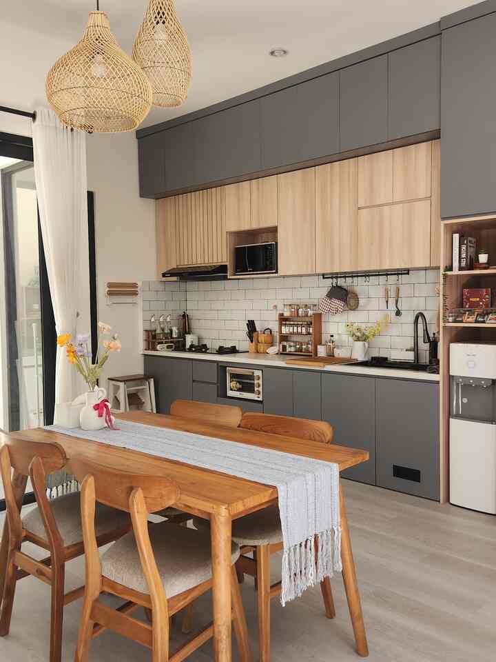 The gray-themed kitchen combined with wood strengthens the Scandinavian impression of our house. Judging from the details that fill our kitchen, the main theme of our kitchen is a wooden kitchen. There are various wooden accessories such as onion holders, shelves, and hanging materials with a wooden feel. 
#Kitchenset #KitchensetMinimalist #WoodenKitchen #KitchenStyling #MejaMakanKayu #DapurSegaris #DapurModern #DapurMinimalis #MakeOverDapur #StylingDapur #DapurImpian