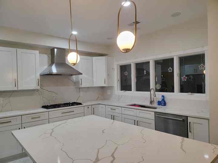 Clean, classic, and just the right touch of warmth—our white quartz countertops and crisp white cabinets shine even brighter with the rich contrast of bronze pulls. Loving the timeless feel with a modern twist! #kitcheninterior #whiteinterior #quartz #ceilinglights #bronze #clean 