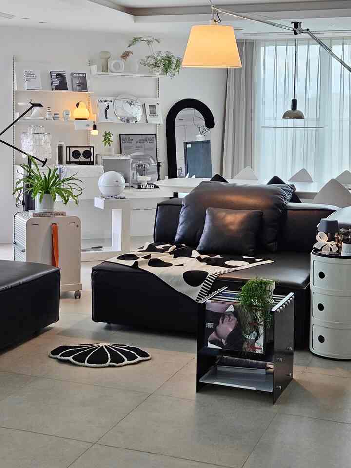 Monotone modern living room featuring Geneva sofa and wall shelves with a clean, elegant atmosphere