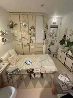 White and beige toned compact bedroom for single household with efficient storage and remote work desk in a minimal style