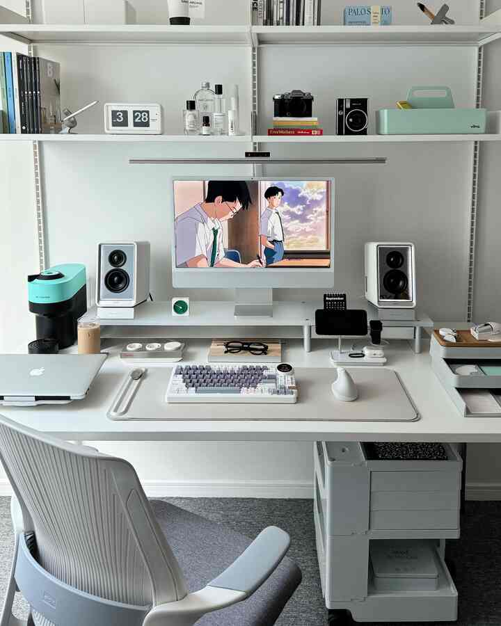 Modern home office in white and gray tones, featuring an iMac and tidy desk in a compact workspace