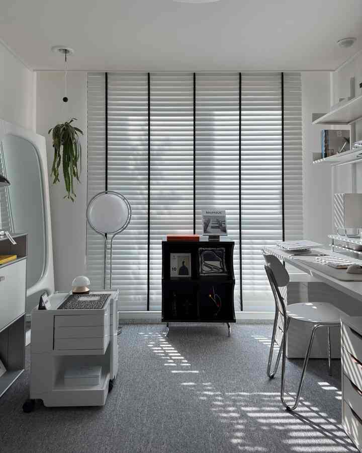 Modern and clean study space in white and black tones, featuring Deormon wood blinds and simple furniture layout