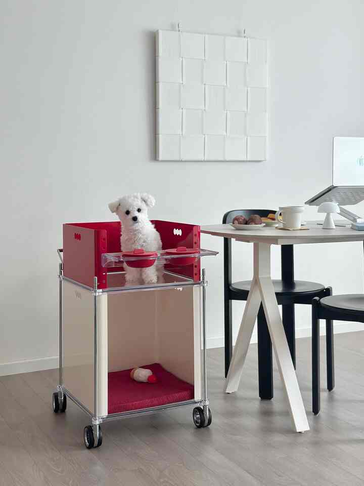 White and red toned studio dining space featuring a dog pet house and dining chairs with modern atmosphere