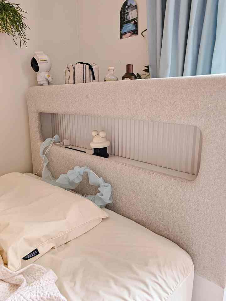 White and natural toned kids' room featuring a storage bed frame with a clean and simple design