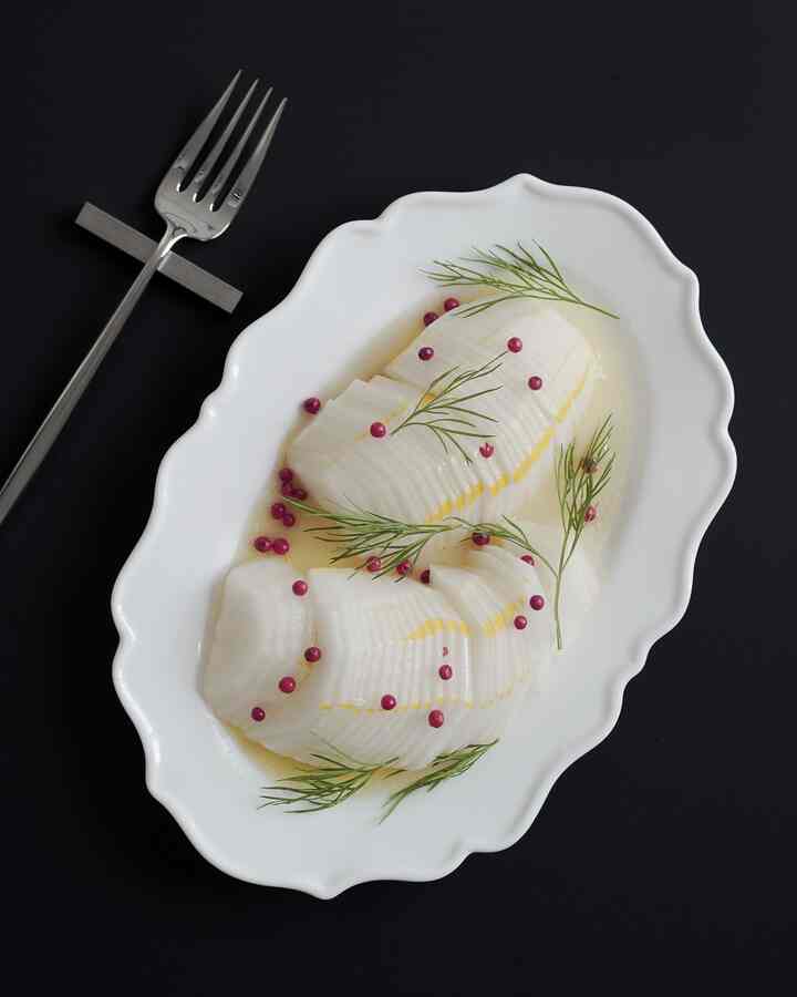 Simple summer taste home cafe style plating on a black dining table with white plate and fork