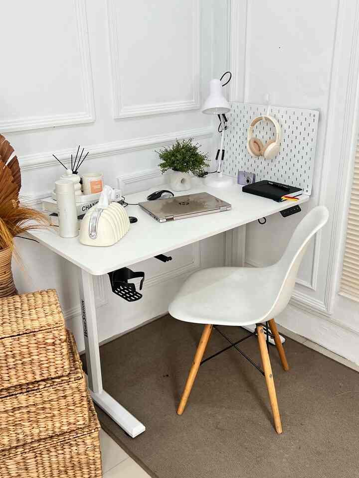 White and wood tone 2.5x2.5m home office space featuring a minimalist desk setup with natural accents