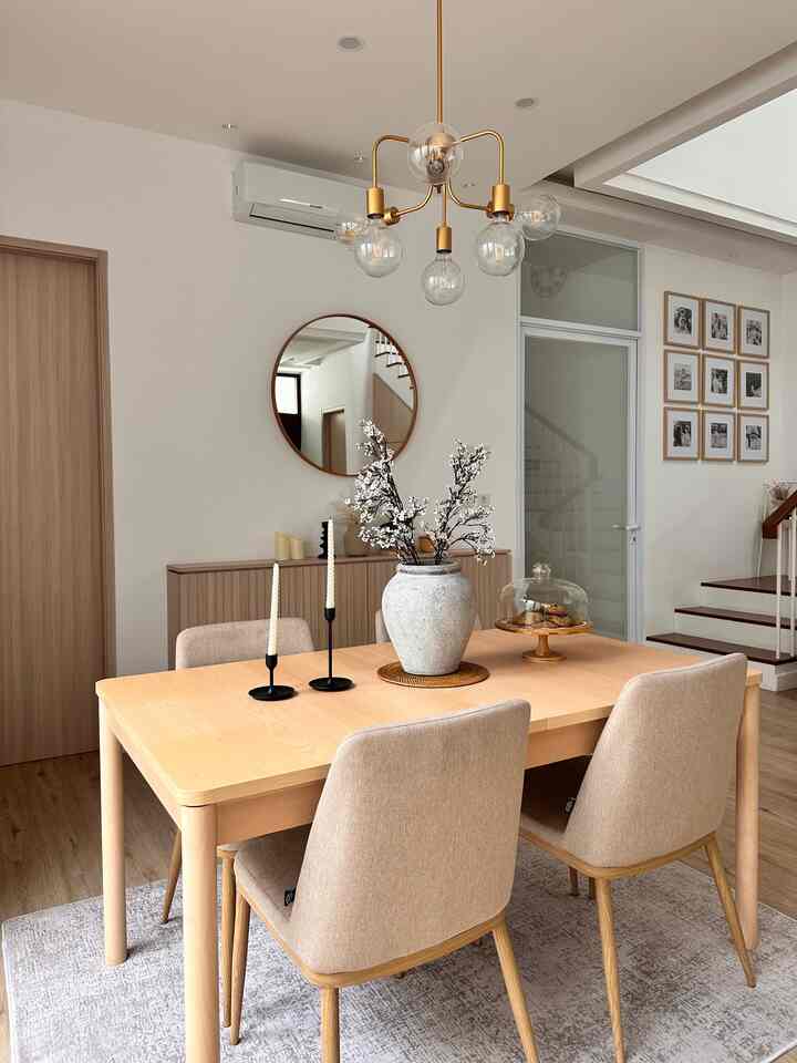 Beige and wood tone dining room featuring a simple dining table and chairs with a cozy atmosphere