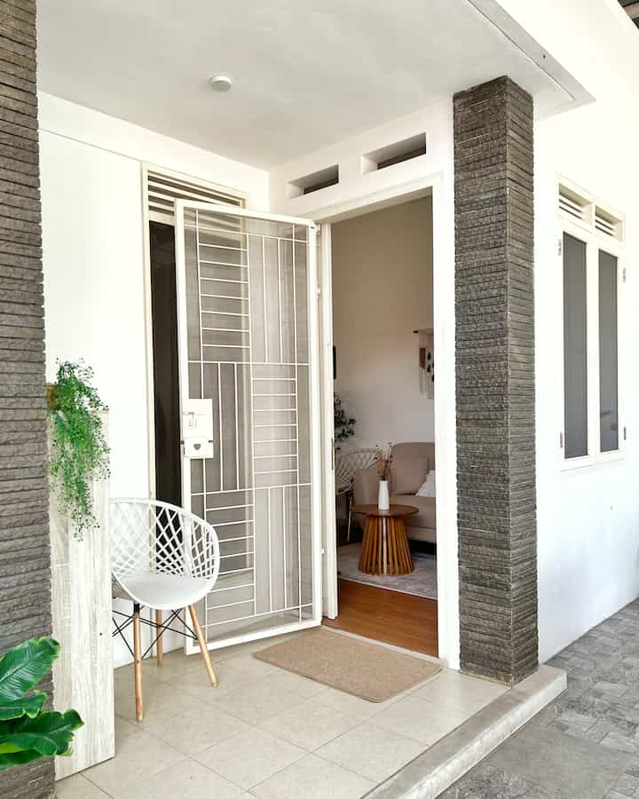 Welcome to our humble abode..

This facade rarely appears because in my opinion it still lacks aesthetics 🥹. The facade has a minimalist style which is still in its original condition as it came from the developer when we bought it from the old owner, only the position of the entrance was changed to the right side. I'm a bit sorry that in the past the renovations didn't replace the wide windows, replace the floor tiles, etc. because of budget considerations

It's really a wishlist to make over a small garden by installing a rooster and an aesthetic Pinterest-style sitting spot. Because the terrace is small, I only put a shoe rack and single chair, as well as some artificial plants. There are quite a few small pots of live plants that I just bought some time ago. Hopefully I can learn to care for plants so that the facade is more beautiful 🌼

#facadestyle #facadeideas #facadeinspirations
#home #house


