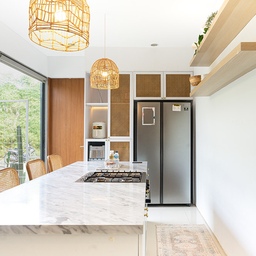 Effortless elegance meets modern charm in our open space white kitchen, adorned with a sleek white carara marble countertop and illuminated by the warm glow of a tasteful rattan pendant hanging lamp. 
Pull-out shelves in our pantry is a smart solution for neatly storing dry ingredients, coffee, and tea, making everything easily accessible.
Design & built by Hyde Living.
#KitchenStyling
#IdeDekorDapur
#MakeOverDapur
#WhiteKitchen
#MarbleCountertop
#Nordichome
#TheABChaven
