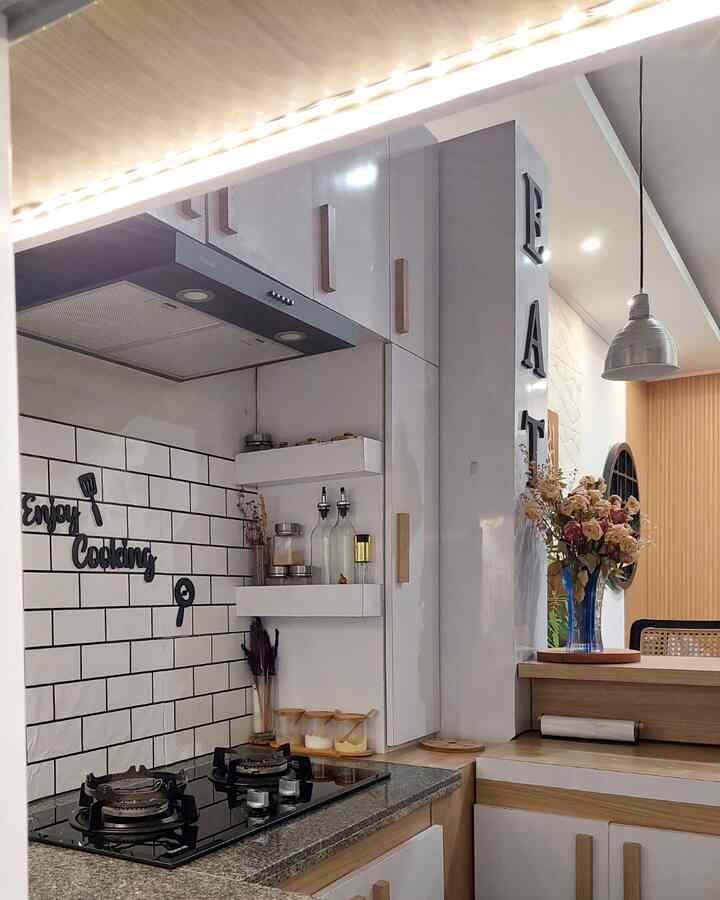 White and wood tone kitchen space featuring a cozy and clean home cafe style interior