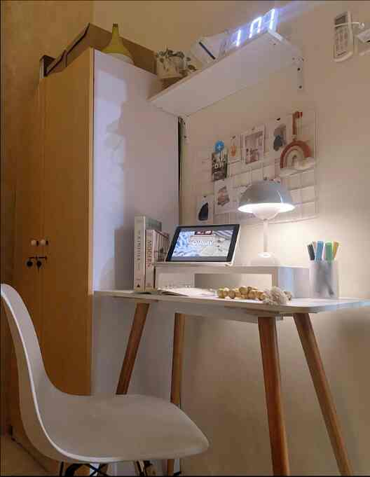 White and wood tone kids' room featuring a minimalist desk and chair for remote work and study