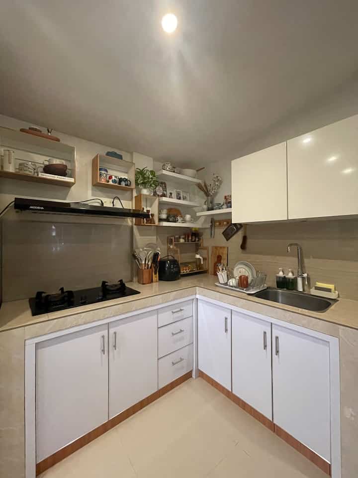 From when I was little until before I got married, I was used to seeing my mother always arranging, tidying and cleaning the house, especially the kitchen area where my mother cooked and made cakes for my father, me and my younger siblings to enjoy. I then imagined having a kitchen whose overall appearance was white with wooden accents that would always be neat and clean. Now, even though it is simple, I am very grateful to be able to have a kitchen that is comfortable for me and my family. It's not exactly the same as the dream kitchen I expected, but I'm still grateful because I have everything we need in my little kitchen.

#MyDreamKitchen #IdeDekorDapur #DapurEstetik #whiteandwood #bohemianminimlist