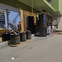 Salah satu keputusan terbaik mendesign dapur ini adalah menggunakan top table Quadra. Type yang kami pakai ini adalah Quadra Bianco Lassa. Dengan motif alami, kelebihan utamanya adalah mudah sekali dibersihkan. Tidak perlu khawatir tumpahan air masuk ke pori-pori top table.
Tips lain adalah, sebisa mungkin, tidak banyak barang di permukaan top table. Supaya rumah tidak terlihat penuh. Kalau kalian, apa tips kalian dalam mendesign dapur? 
#MyDreamKitchen #IdeDekorDapur #DapurEstetik #RumahBuaran #InspirasiDapur #TropicalHouse #IdeRumah
