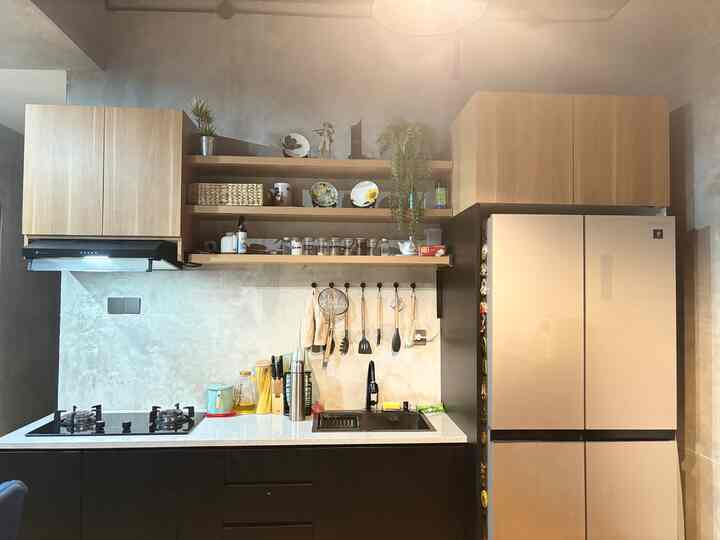 Beige and natural tone kitchen space featuring kitchen utensils and storage ideas with a clean, organized atmosphere