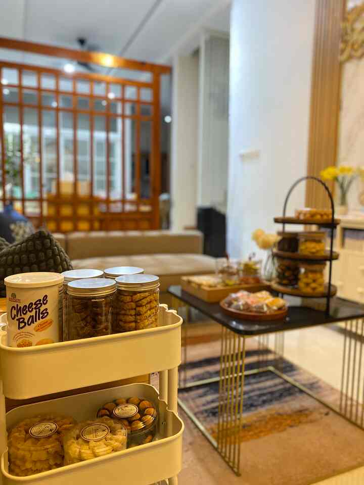 Warm beige-toned living room featuring a beige sofa and kitchen cart, creating a cozy home cafe atmosphere