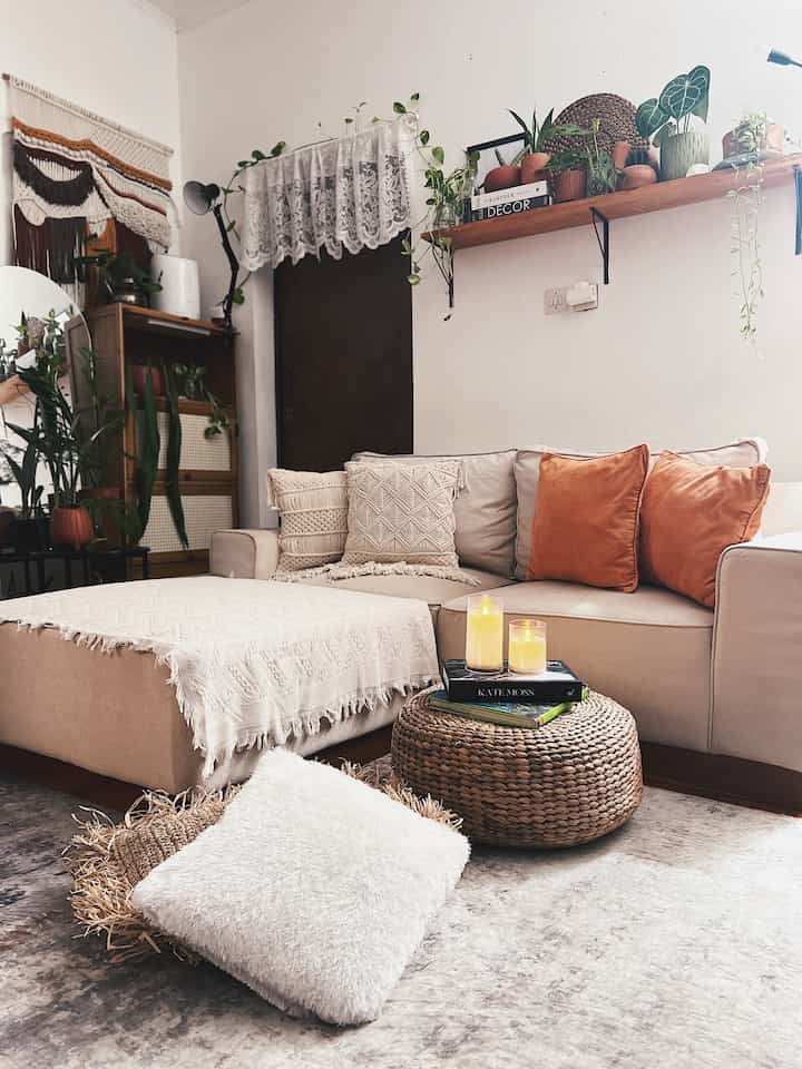 Natural-tone two-person living room featuring beige sofa and wood-tone decor creating a cozy atmosphere
