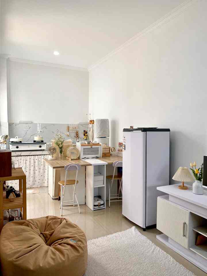 White and wood tone compact dining room featuring cafe style elements in a simple, open space interior