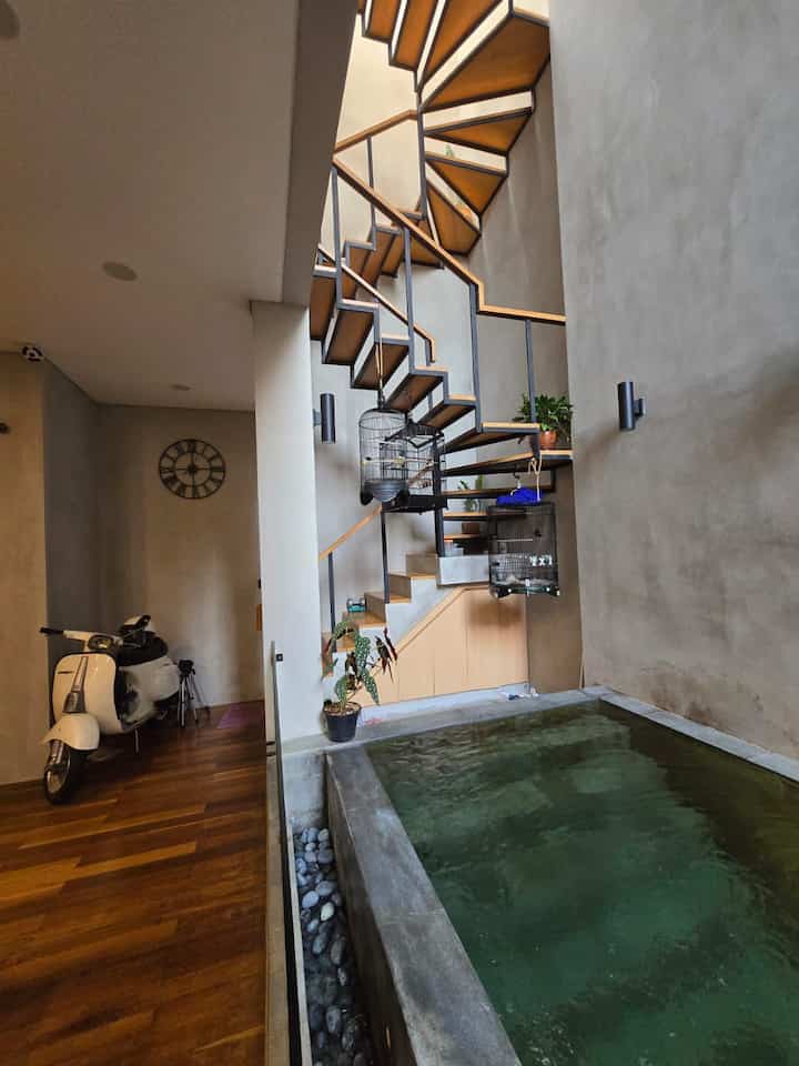 This staircase area and its surroundings often become a special attraction for people who visit Buaran's house. The placement of a classic Vespa motorbike often invites people to ask, is this just decoration, or does it turn on?
The answer is yes😀

#HouseStairs #InspirasiTangga #HomeDecor #DecorIdeas #JKTTimur #Buaran #RumahDesignArsitek