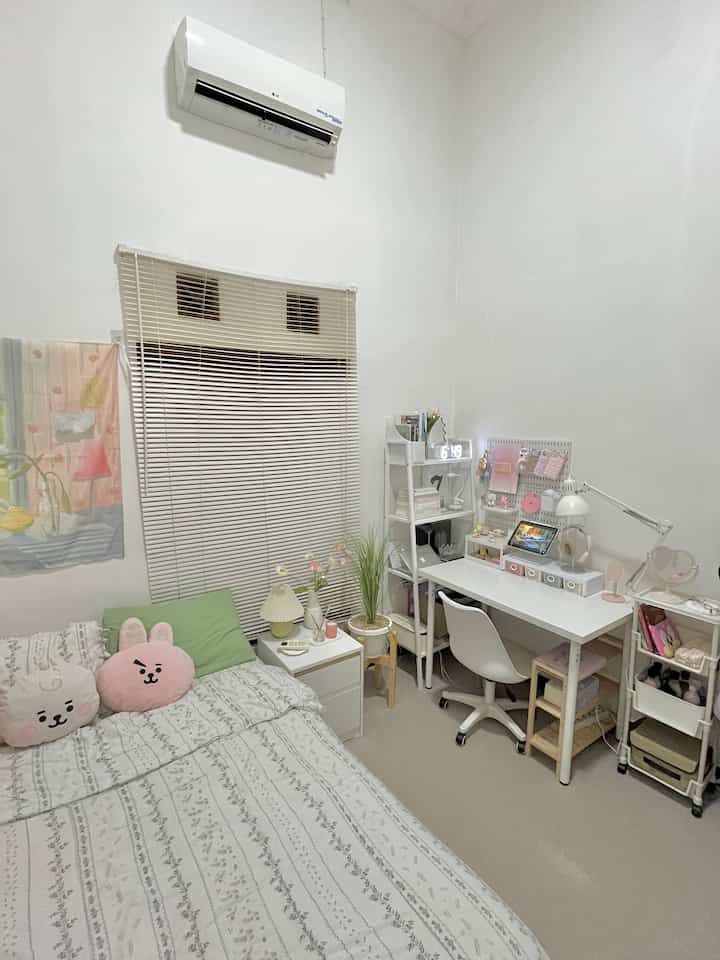A simple 3x3-meter bedroom dominated by white and natural tones, featuring a bed, desk, and shelves neatly arranged